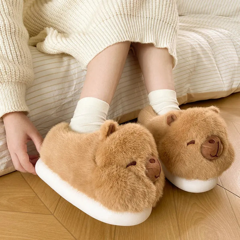Light brown plush women's winter slippers with artificial wool lining and a round toe.