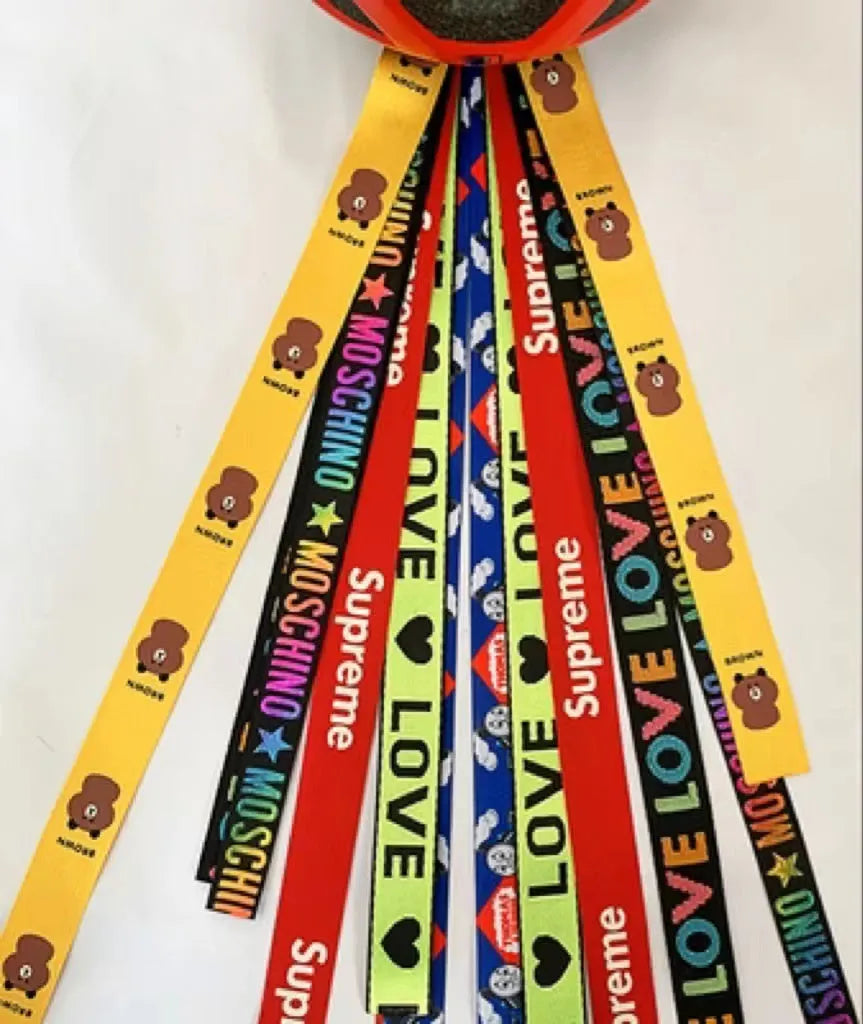 Children's decorative helmet streamer ribbon in multiple colours for roller skating and skiing safety gear.