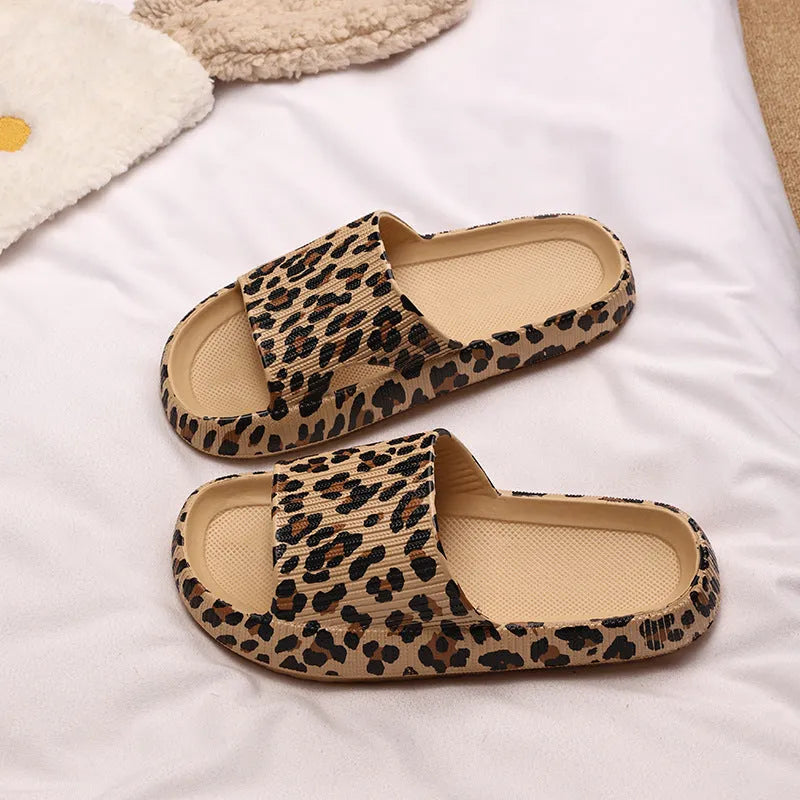 Women's leopard print slipper with thick EVA sole shown in multiple colour and print options.