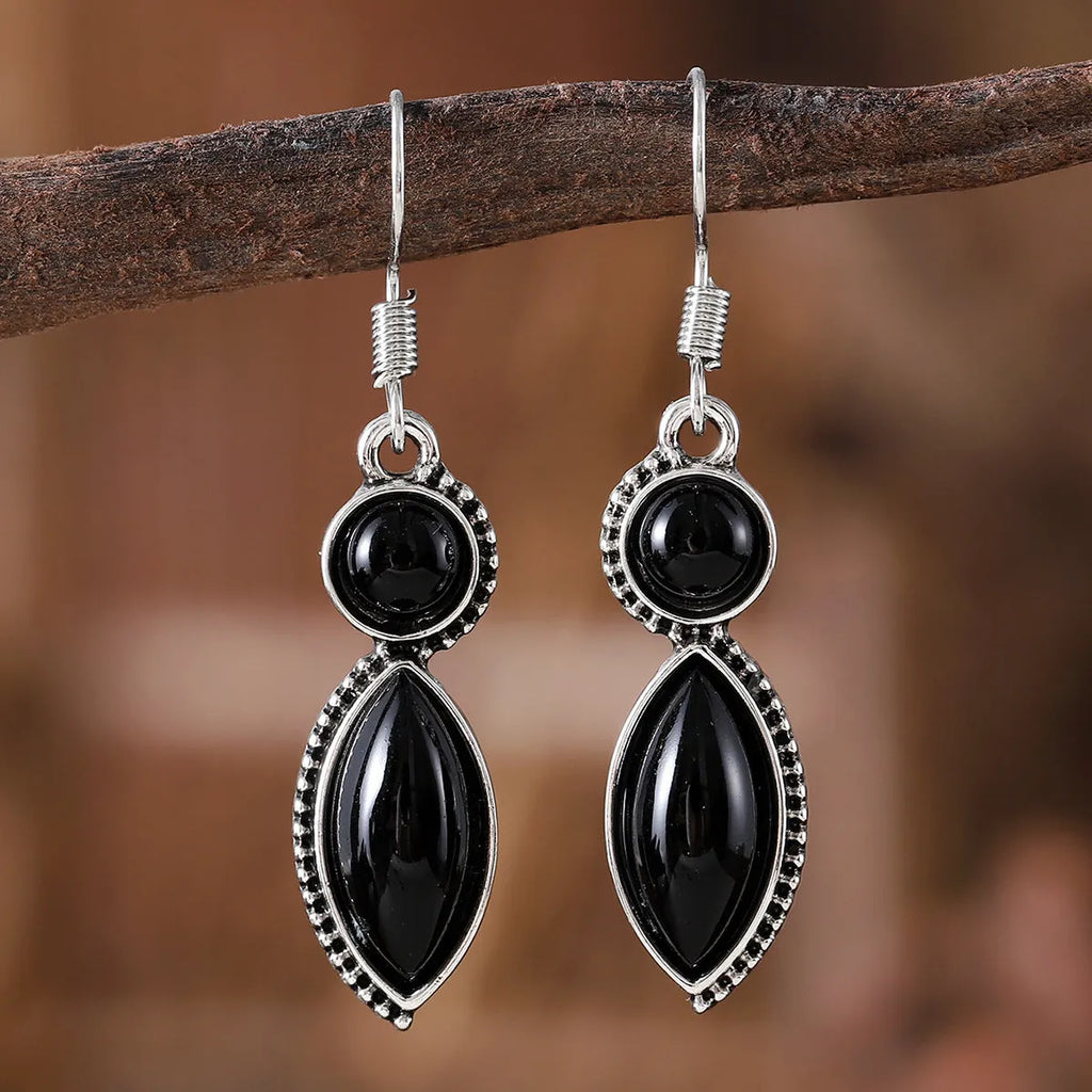 Geometric vintage pendant earrings with black and purple electroplated finish and round elements