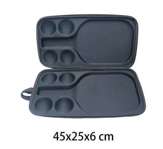 Black waterproof pickleball storage bag with two shoulder straps, showing size relative to a racket and balls.