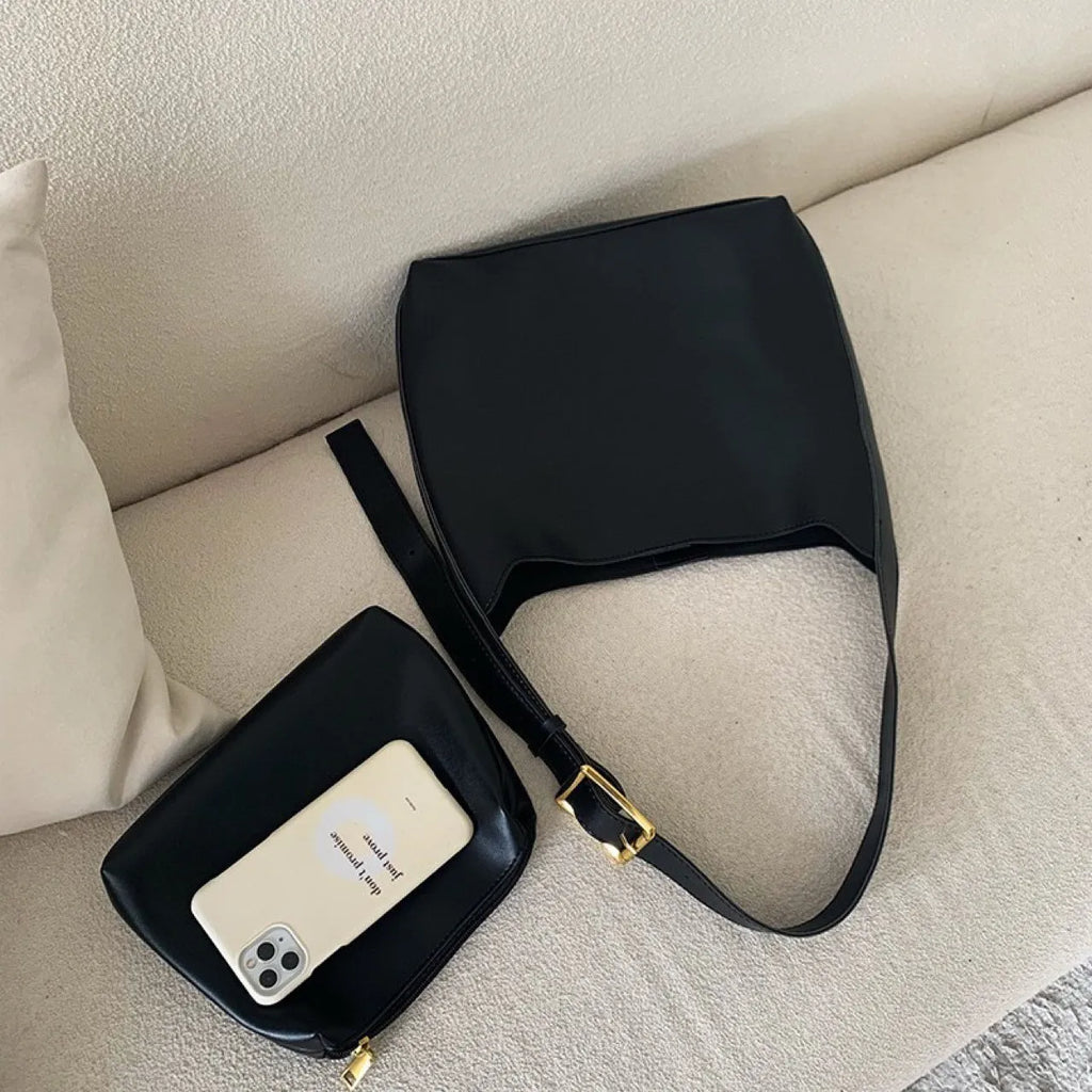 Women's soft PU shoulder bag with swing thread detailing in black ribbon or brown colour options