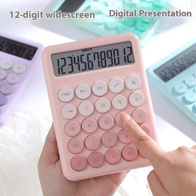 Violet, blue, green, and pink gradient colour desktop calculator on a desk.