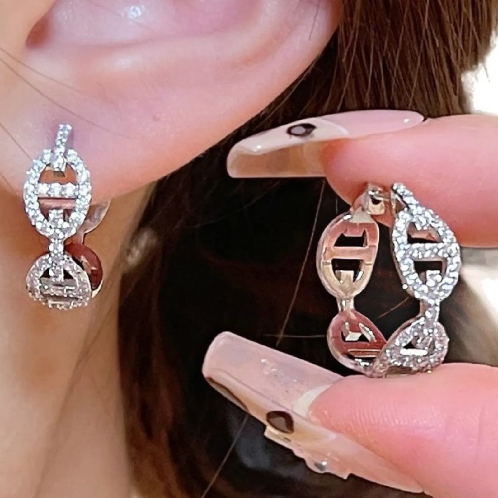 Ladies diamond-effect drop earrings in silver, gold, and rose gold electroplated finishes.