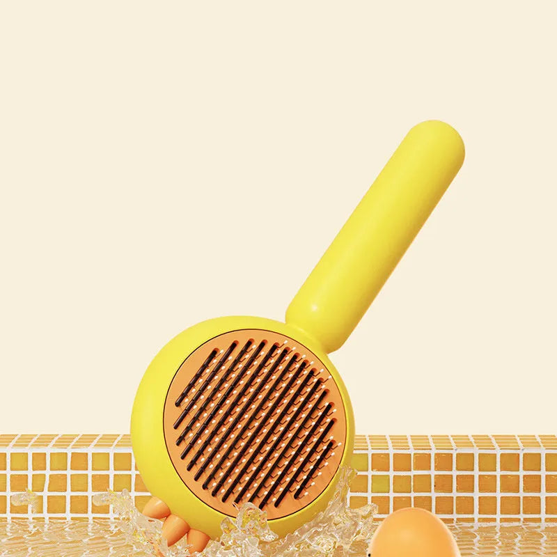 Self-cleaning pet grooming brush with purple handle and stainless steel bristles