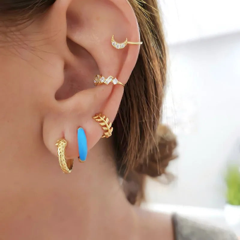 Geometric U-shaped silver earrings with an oval epoxy resin centre in a choice of seven colours.