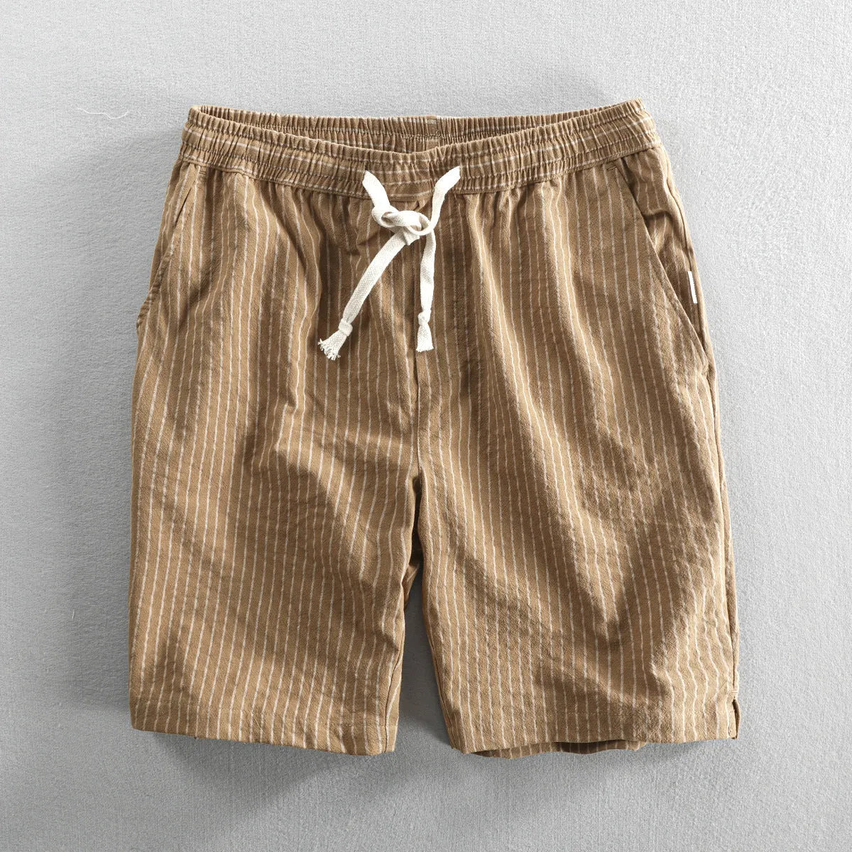 Men's striped casual shorts in loose straight-leg fit with elastic waistband.