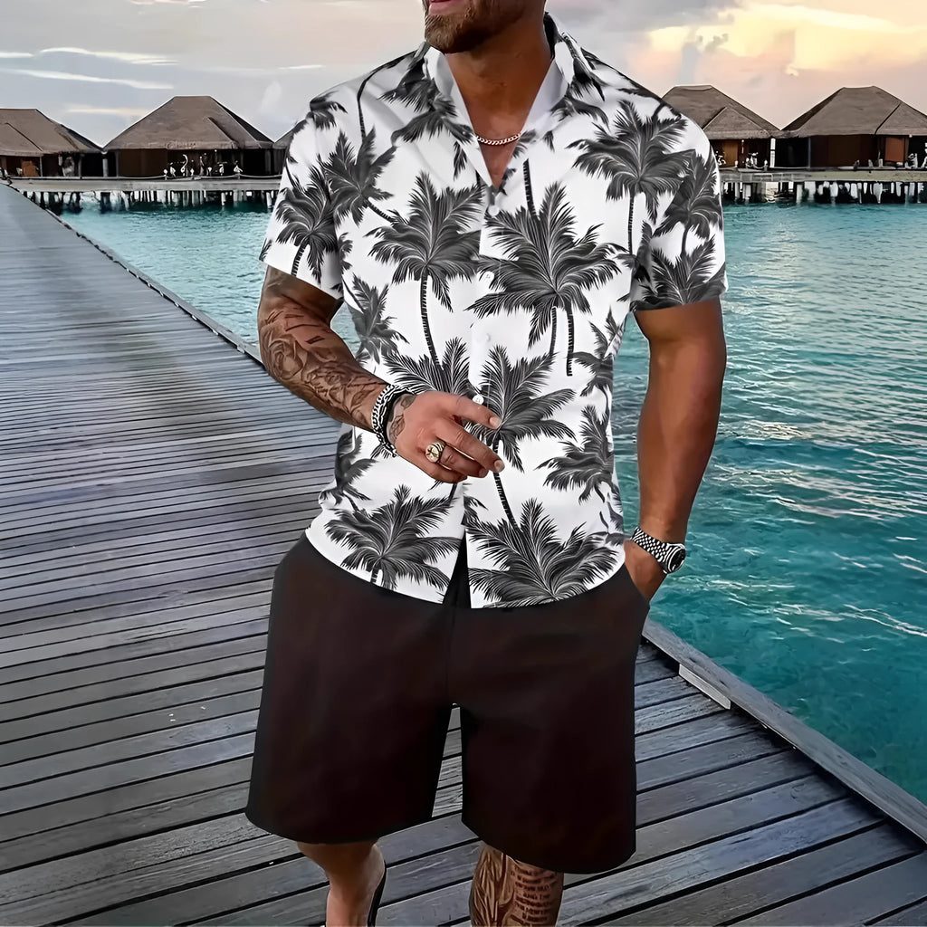 Man wearing a blue Hawaiian 3D printed short sleeve top and matching shorts leisure suit set.