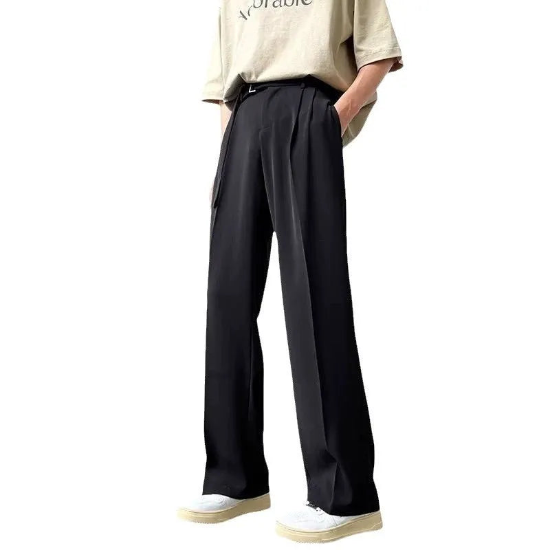 Black straight leg wide trousers on hanger showing loose fit and non-ironing fabric