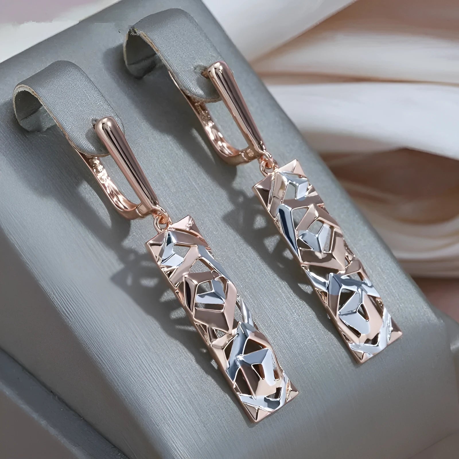 Rectangular two-tone hollow stud earrings with geometric design and electroplated alloy construction