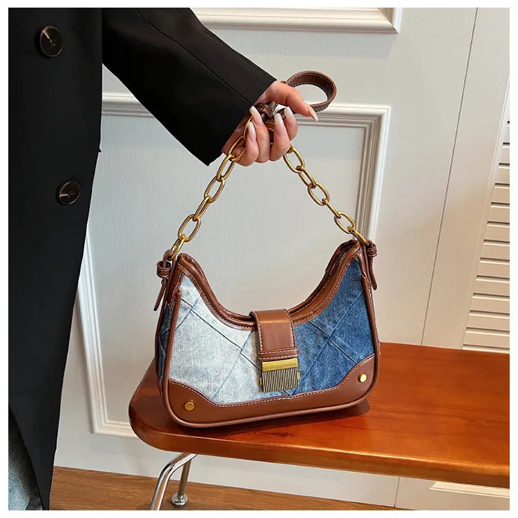 Brown denim women's shoulder bag with diamond mesh panel and chain strap showing bucket shape