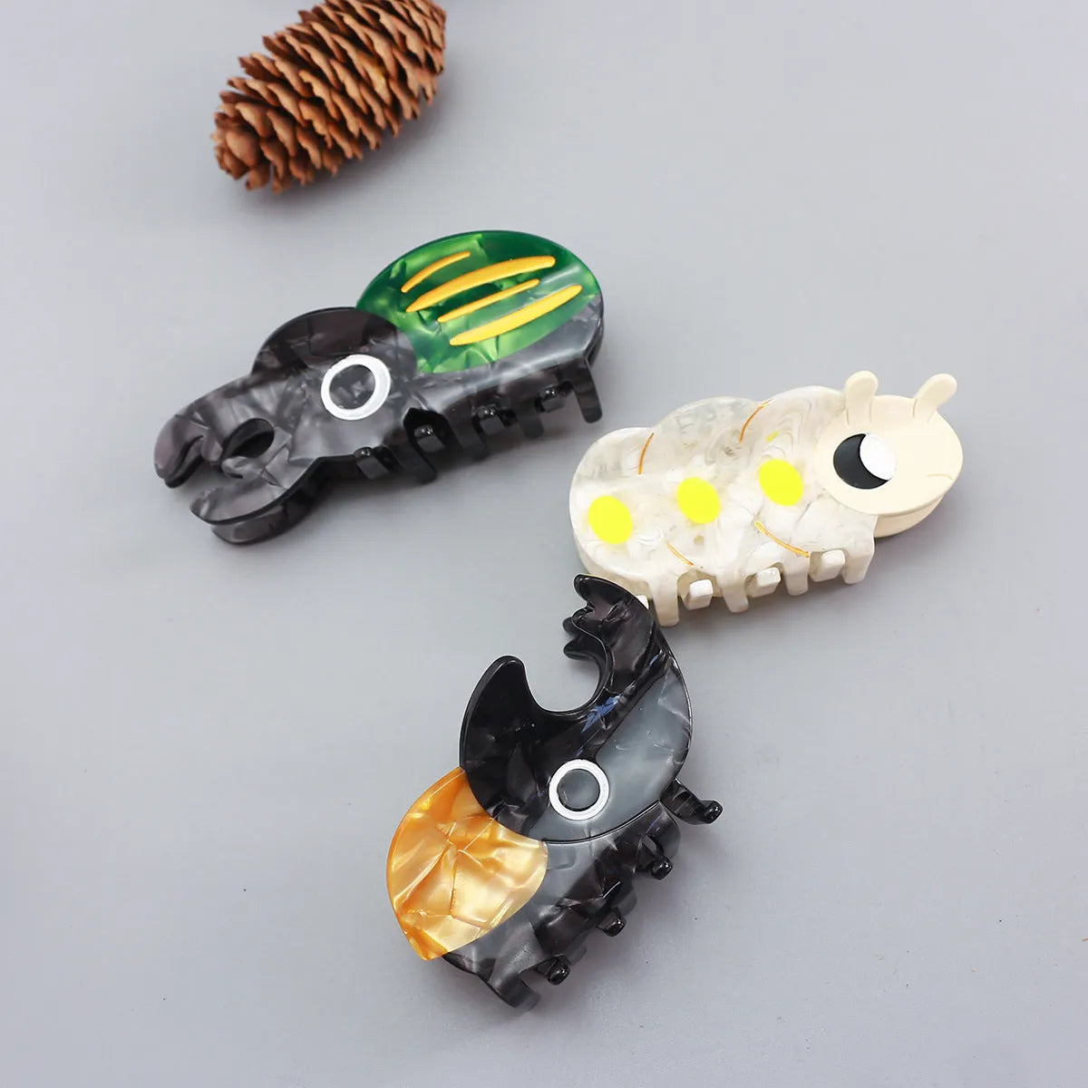 Handmade cellulose acetate beetle grip decorative clip with insect biology cartoon design