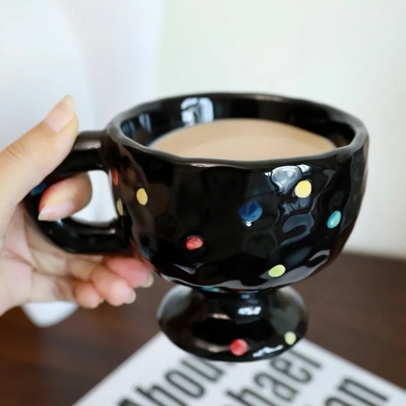 Hand-pinched irregular ceramic mug in solid colour with modern simple style, shown from side angle
