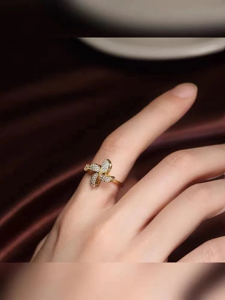 Rotating windmill ring with micro-inlaid design in gold or silver electroplated finish