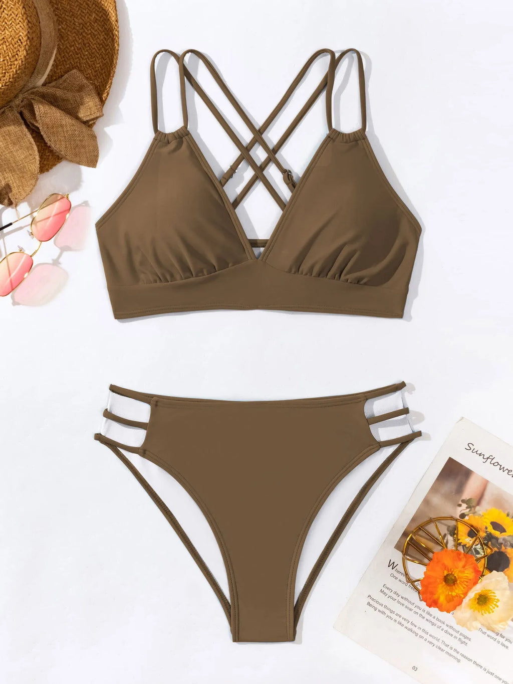 Women's black V-neck halter bikini with split leg shorts on a mannequin.