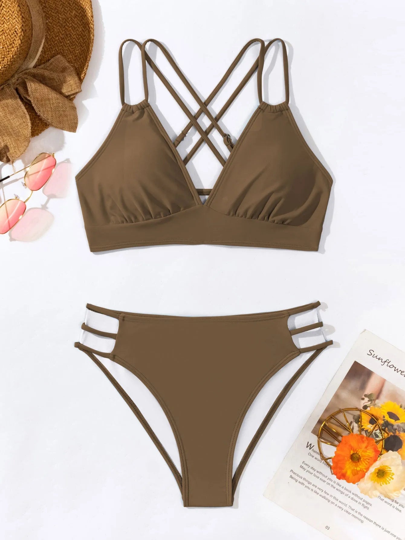 Women's black V-neck halter bikini with split leg shorts on a mannequin.