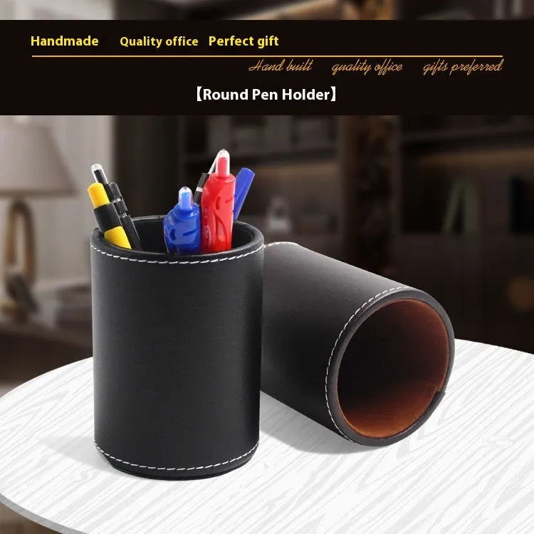 Round black leather pen holder on a desk