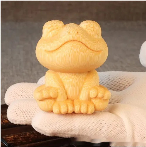 Solid bamboo smiling frog carving ornament measuring 5cm tall with cartoon design