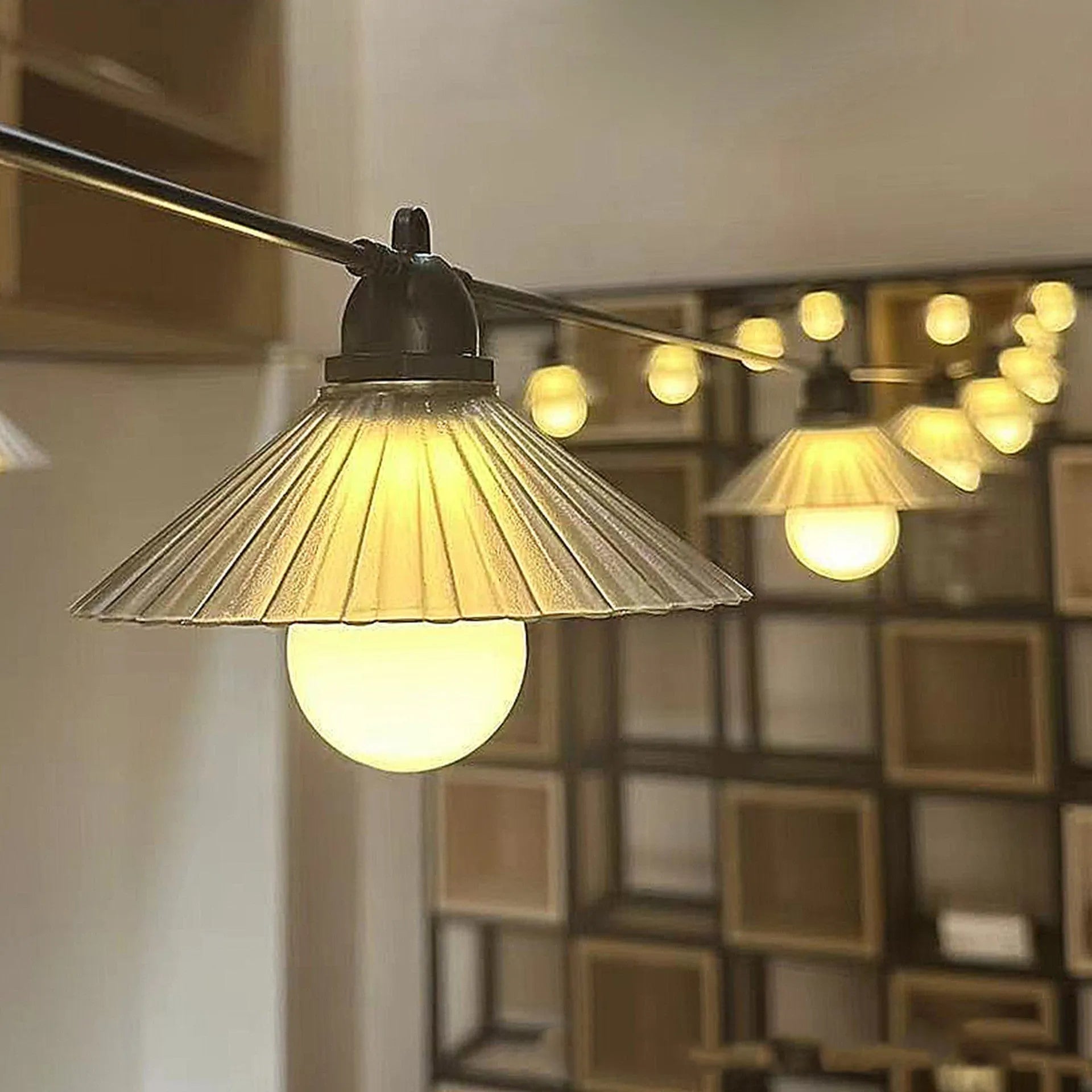 Outdoor LED string lights with flower-shaped bulbs in warm white and colour options.