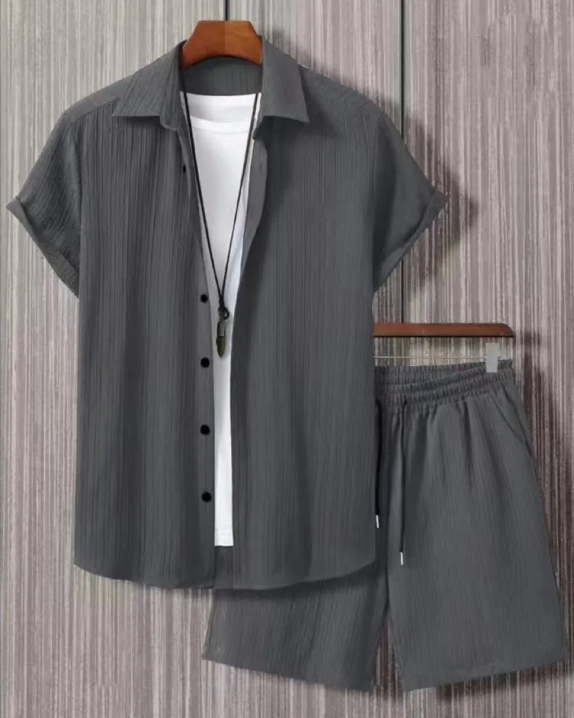 Man wearing black and white jacquard print short sleeve suit with shirt-style jacket and matching shorts
