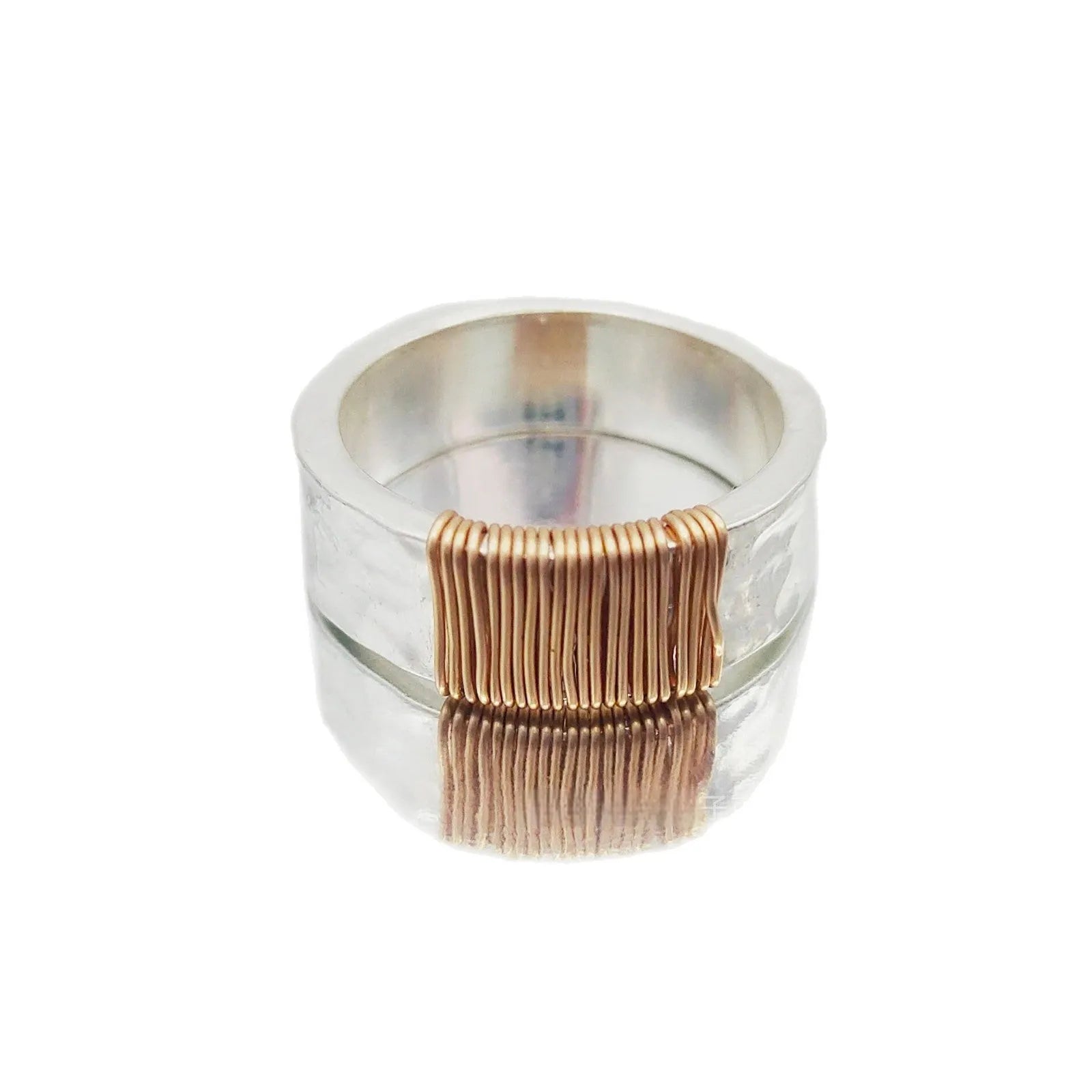 Wide-faced copper geometric bracelet with silver gold electroplated coil finish