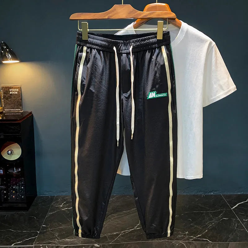 Men's black cotton harem pants with a loose fit and mid waist