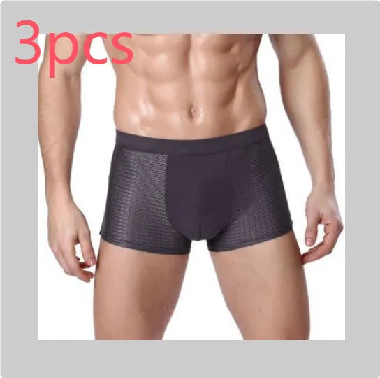 Men's solid colour ice silk modal boxer briefs with U-type convex design and mesh fabric.