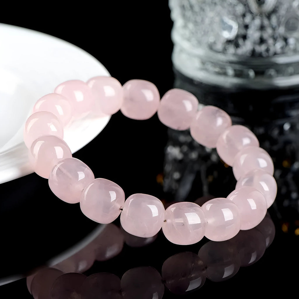 Pink natural crystal barrel bead bracelet with geometric 11mm x 12mm beads.