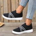 Black women's flat knit mesh shoes with tassel detail and rubber sole