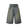 Men's distressed denim shorts with raw edge detailing in straight leg cropped silhouette