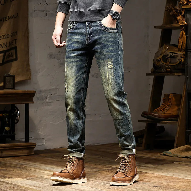 Men's skinny jeans in retro colour with zip fly, showing stretch denim fabric and slim pencil pants cut