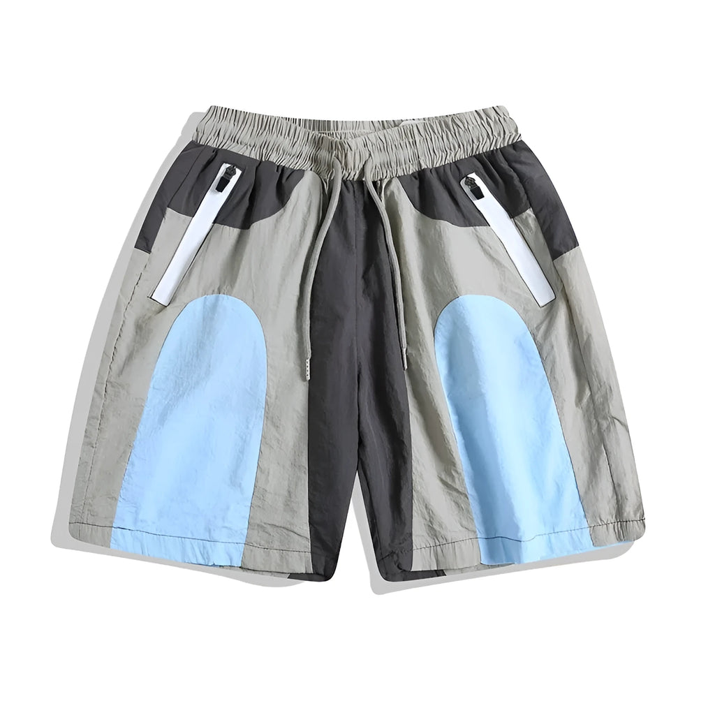 Blue men's patchwork loose-fit quick-drying shorts laid flat, showing straight-leg cut and tether fly.