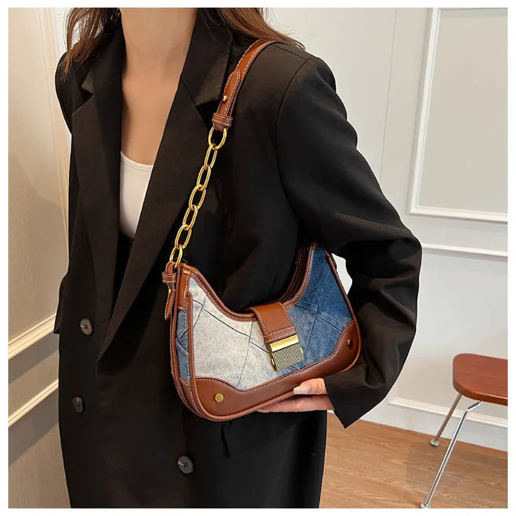 Brown denim women's shoulder bag with diamond mesh panel and chain strap showing bucket shape