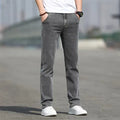 Men's smoky gray straight leg jeans with low waist and zip fly made from elastic rabbit fur fabric