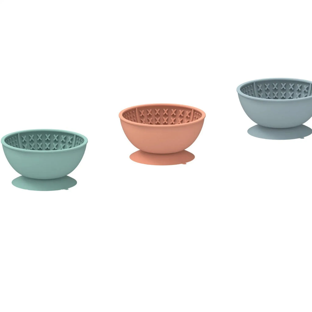 Cyan silicone pet licking mat bowl with textured surface and suction cup base for slow feeding.
