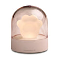 Grey cat paw shaped USB rechargeable night light and music box with soft glowing light.