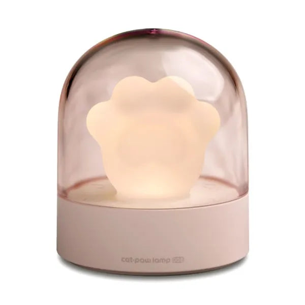 Grey cat paw shaped USB rechargeable night light and music box with soft glowing light.