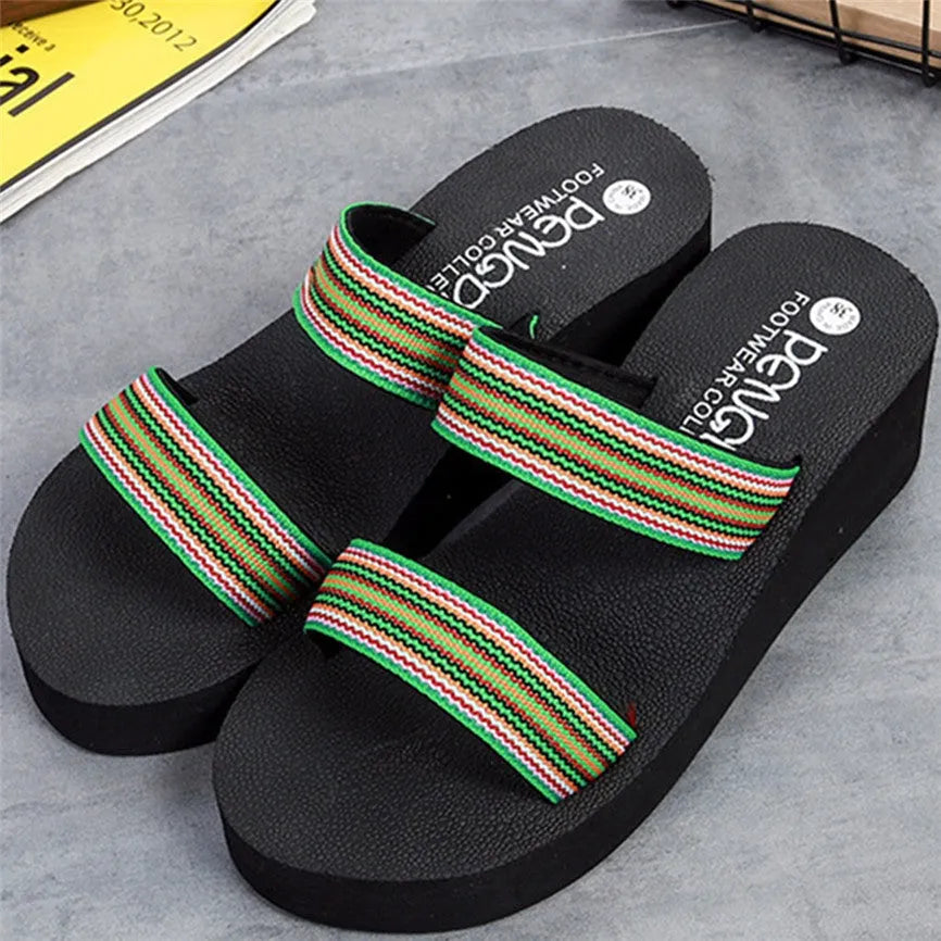 Women's brown bohemian slippers with elastic strap and a raised rubber sole heel.
