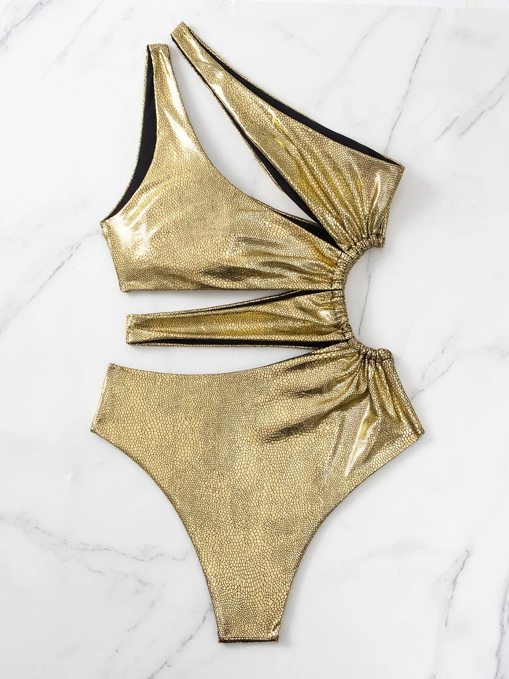 Gold women's one-piece swimsuit with backless and sleeveless design on a mannequin.
