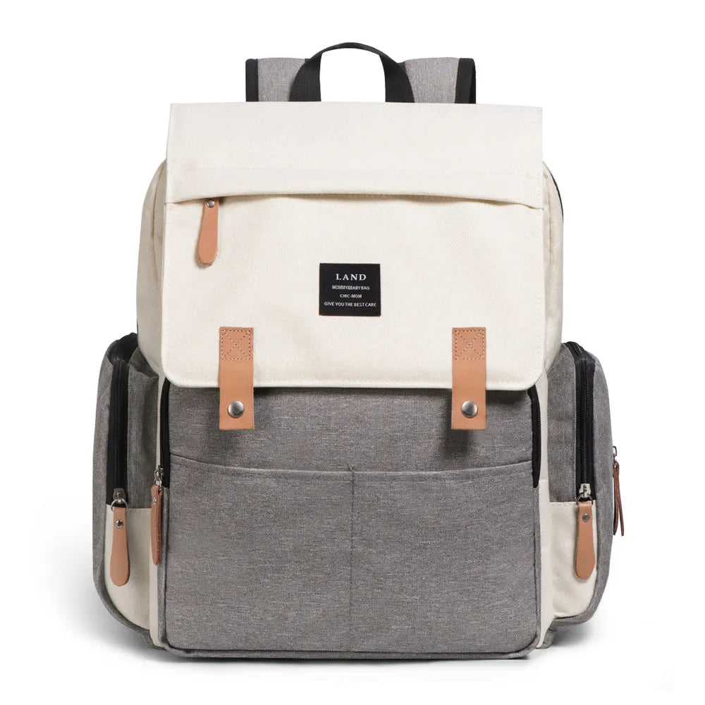 LAND Mommy large grey Oxford cloth diaper backpack with changing mat, showing front compartments.