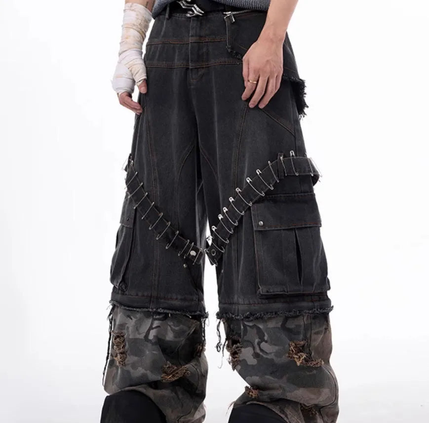 Men's grey camouflage print jeans with splicing panel construction and ribbon detail.