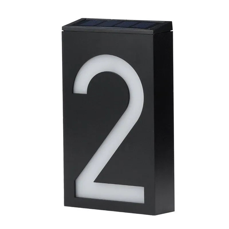 Solar powered house number light with 6 LEDs and IP65 waterproof rating mounted on an exterior wall.