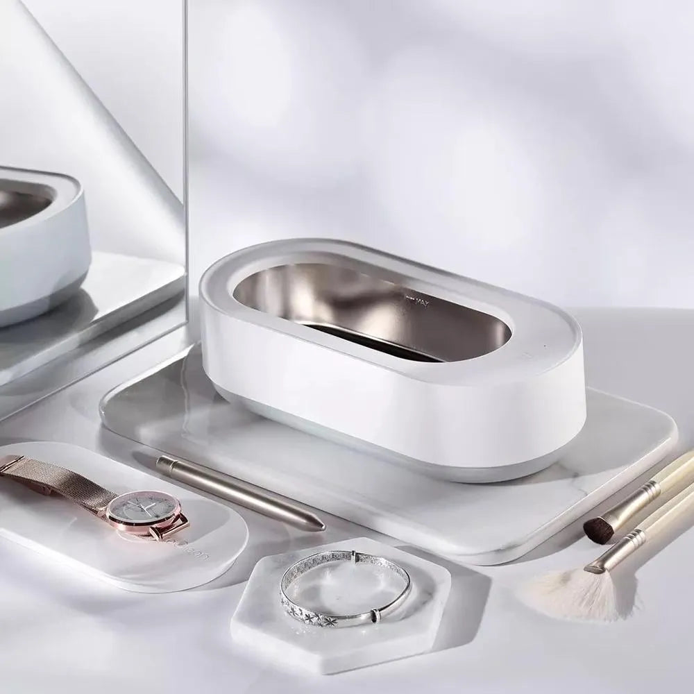 White portable ultrasonic cleaning machine with stainless steel tank and touch button.