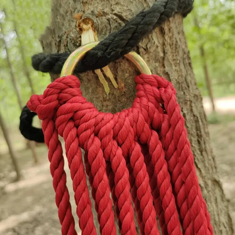 Outdoor nylon rope mesh hammock showing bold weave style, displayed with included tying ropes.
