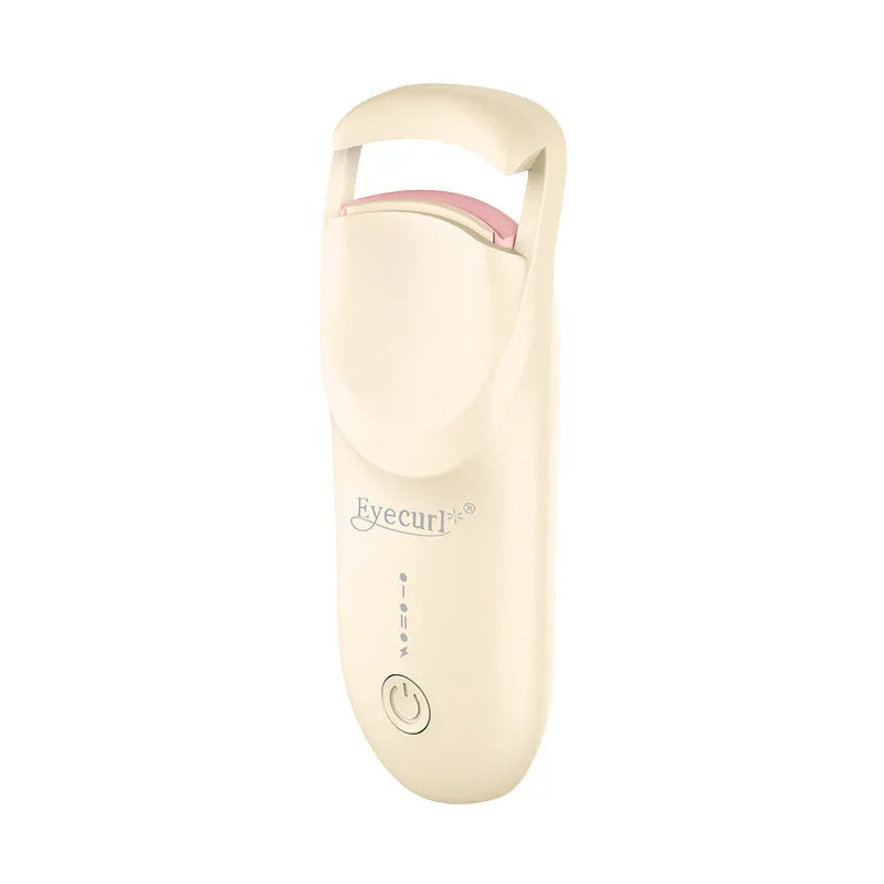 Electric heating eyelash curler in pink with USB charging cable on a white background