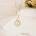 Silver orchid necklace with peace buckle clasp and floral pendant on O-ring chain