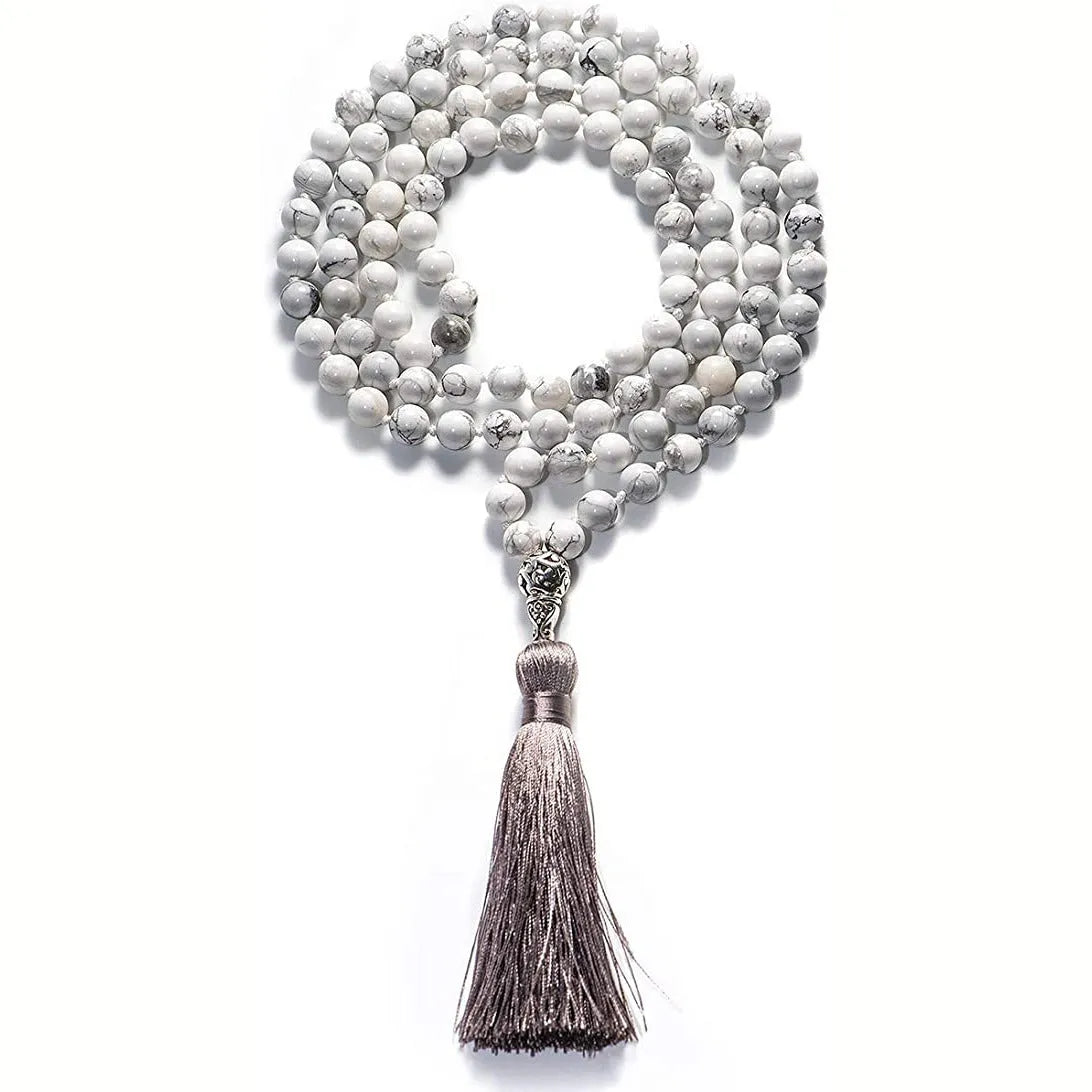 Long multicoloured agate and gemstone tassel necklace with geometric beads.