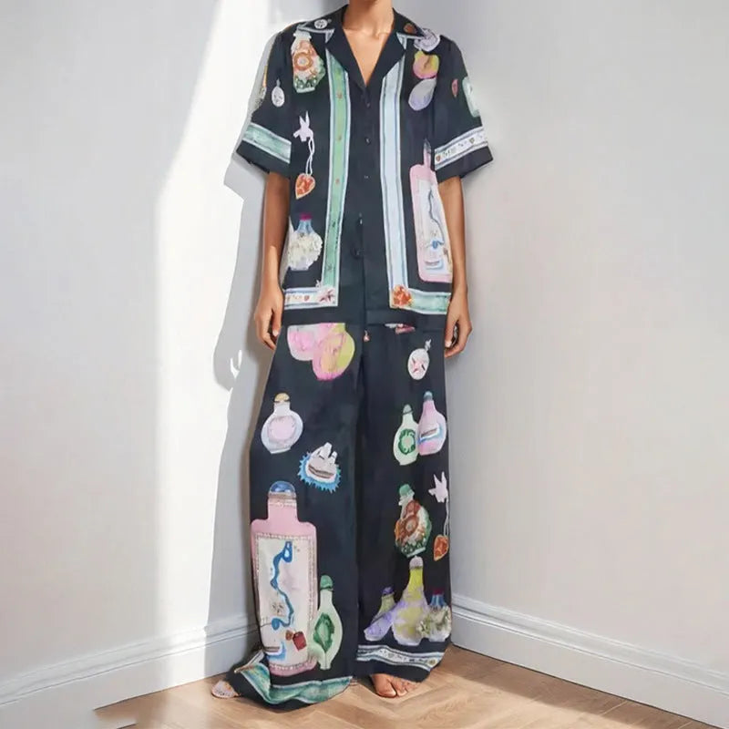 Black women's casual set with cartoon pattern featuring cardigan-sleeve top and matching trousers