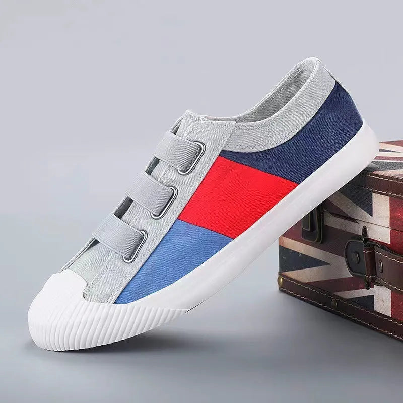 Men's beige canvas low-top sneakers with elastic band fastening and a vulcanised rubber sole.