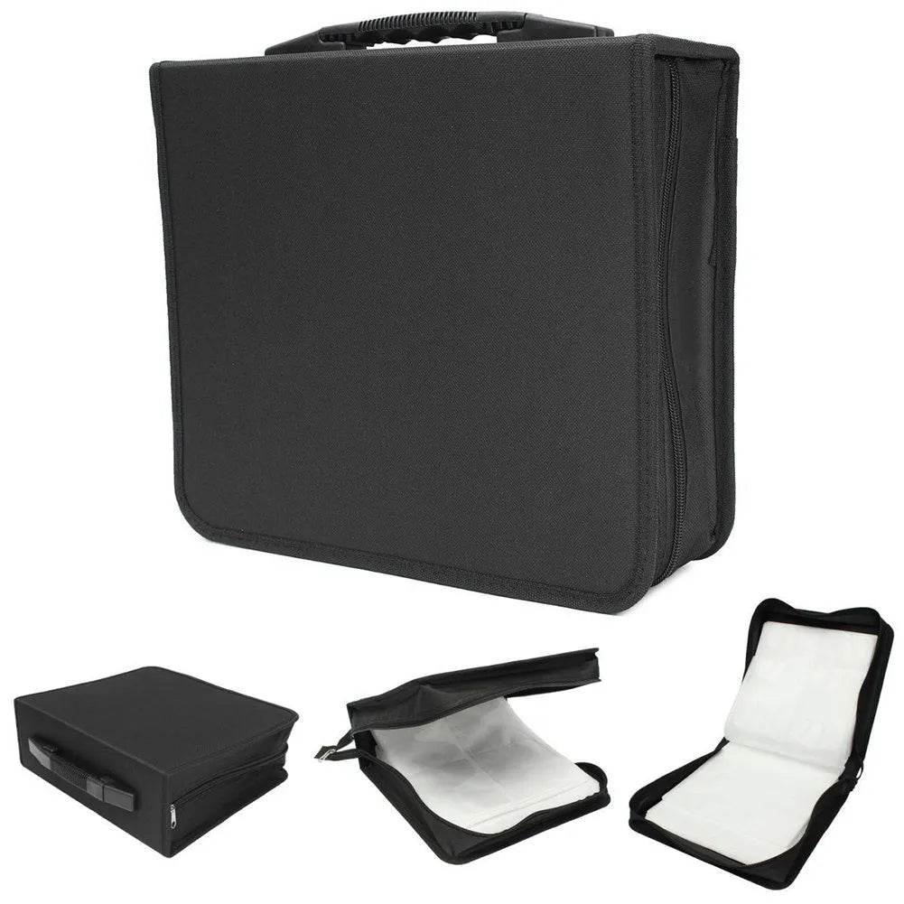 Black Oxford fabric CD and DVD storage binder with a zipper and top carry strap, open to show disc sleeves.